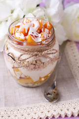 Healthy breakfast - yogurt with  fresh peach and muesli served