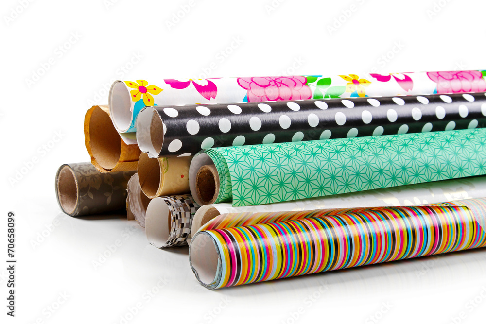 Wall mural rolls of colorful wrapping paper isolated on white