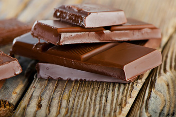 Broken chocolate bar   on  wooden table