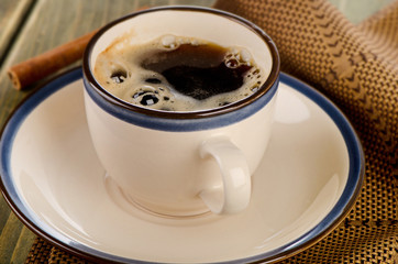 Cup of coffee on a  wooden table