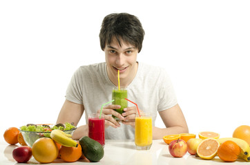 Man having a table full of organic food,juices, organic smoothie