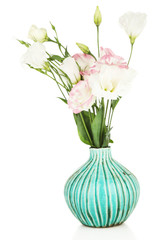 Beautiful eustoma flowers in vase, isolated on white