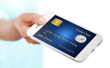 hand holding mobile phone with credit card isolated over white