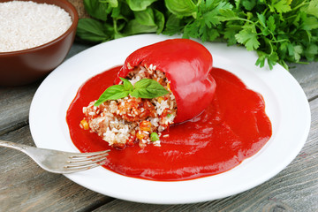 Prepared stuffed pepper with tomato sauce