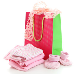 Baby clothes and gift bag isolated on white