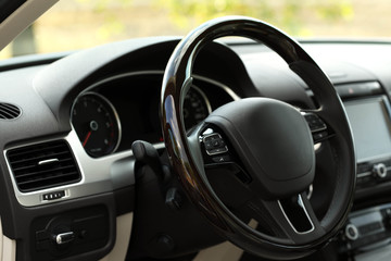 Obraz na płótnie Canvas Modern car interior. Steering wheel, close-up