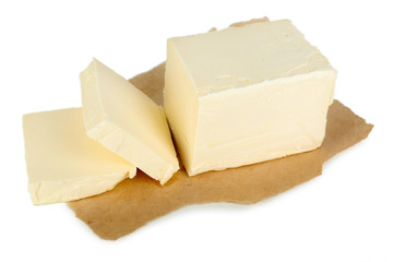 Fresh butter on paper, isolated on white