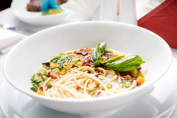 Chicken soup with pasta and vegetables.