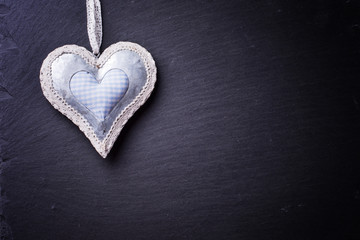 Obraz premium Heart on slate background