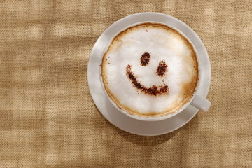 Coffee cappuccino with foam or chocolate happy face
