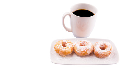 A mug of coffee and homemade doughnut with sugar toppings 