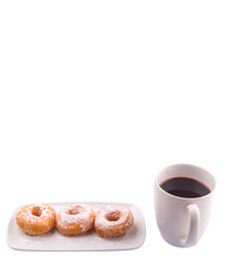 A mug of coffee and homemade doughnut with sugar toppings 