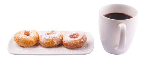 A mug of coffee and homemade doughnut with sugar toppings 