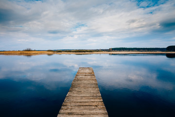 Fototapeta premium Old Wooden Pier. Calm River