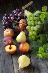 Naklejka na ściany i meble Summer fruits - nectarines, peaches, pears and grape