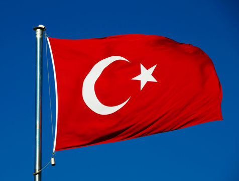 Turkish national flag over blue sky