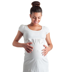 cute pregnant girl in white dress in polka dots - 70673617