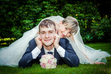 Happy young wedding couple on picnic