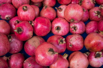 Fototapeta na wymiar group of pomegranates. pomegranate closeup, background