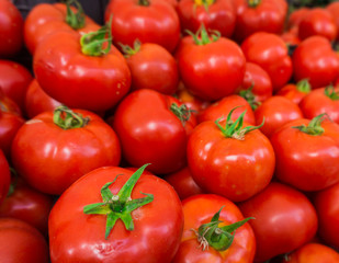 red tomatoes at the market. Fresh ripe tomatoes