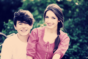 Young couple sitting in park