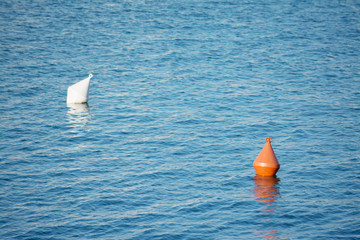 orange and white buoys