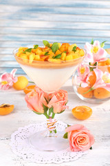 Apricot dessert in glass on table close-up