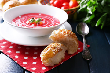 Gazpacho soup on color wooden background