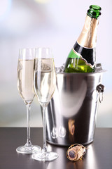 Champagne in glasses and bottle in restaurant