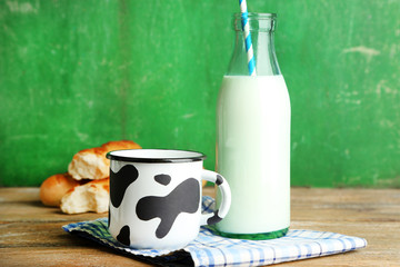 Retro still life with tasty rustic milk, on wooden table