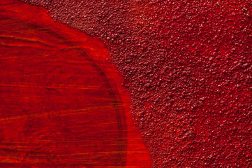 Detail einer roten künstlerischen Wandstruktur