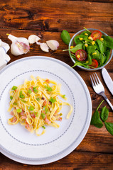 Italian pasta with spring onion and bacon