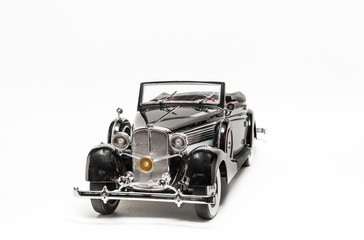 Black and grey classic vintage retro car model on white