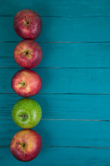 Farm fresh organic red and green apples on wooden table