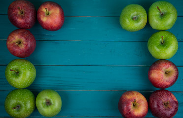 Farm fresh organic red and green apples on wooden table