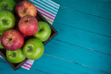 Farm fresh organic red and green apples on wooden table
