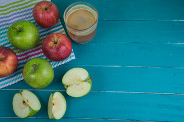 Farm fresh organic red and green apples pressed juice in glass