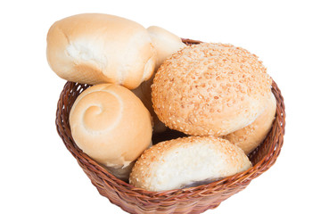 bread in a wicker basket isolated on white background