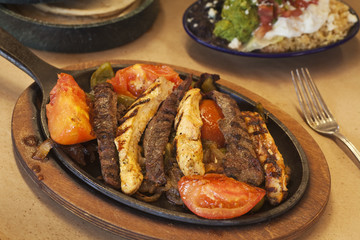 steak and chicken fajitas with gucamole