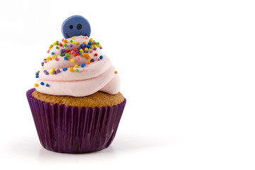 cupcake with pink cream isolated on white background