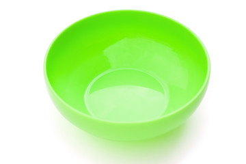 green empty plastic bowl on white with clipping path