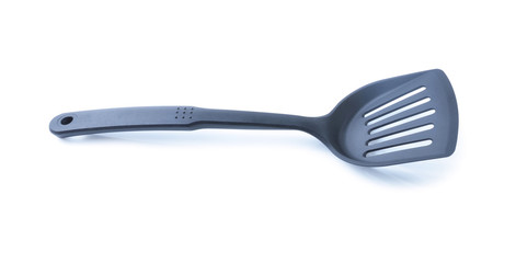 Black plastic kitchen spatula isolated on white