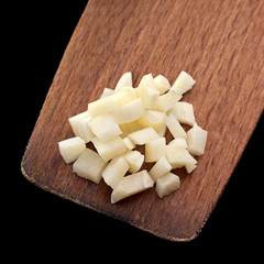 Garlic on wood spoon