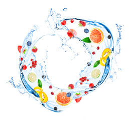 Fresh fruit, berries and green leaves with water splash,