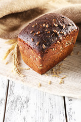 Fresh bread on wooden table, close up