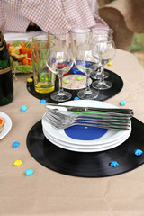 Buffet table with dishware waiting for guests