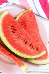 Fresh slice of watermelon on table outdoors, close up