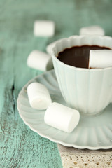 Fototapeta na wymiar Hot chocolate with marshmallows in mug, on wooden background