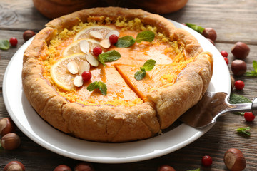 Homemade pumpkin pie on table