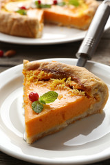 Homemade pumpkin pie on table